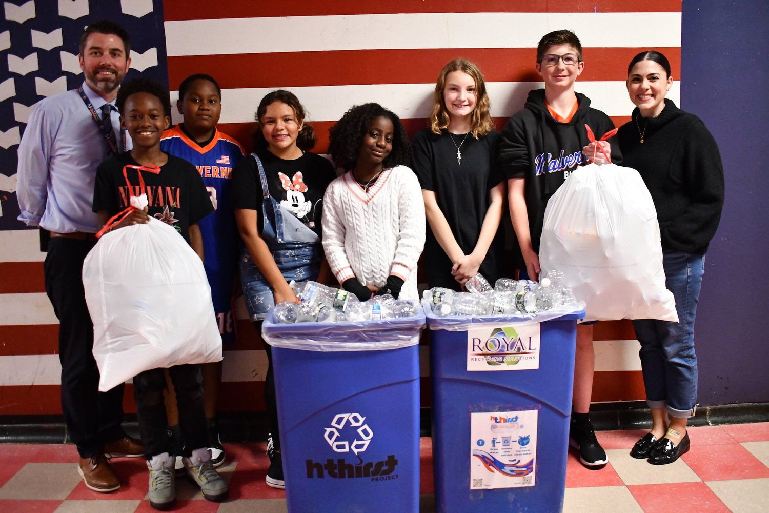 Howard T. Herber Middle School Assistant Principal James Miller with Thirst Project student ambassadors Samore Seraphin, Kamren Milliner, Angie Perez Bojorge, Jessica Williams, Ava Schachtel, Markus Daly and English and News Literacy teacher Ms. Acierno.